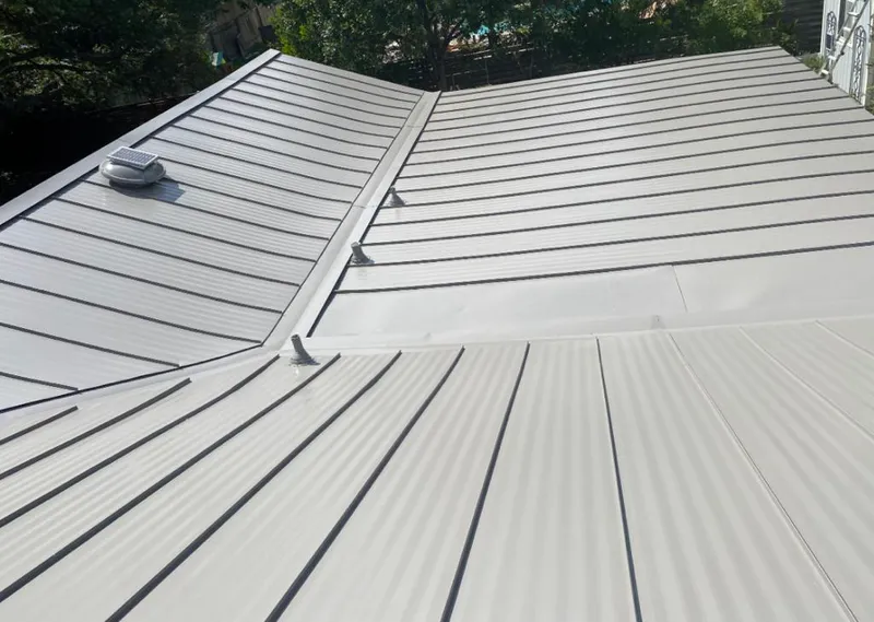 Solar attic fan installed on a metal roof for Roof Ventilation in White Hall